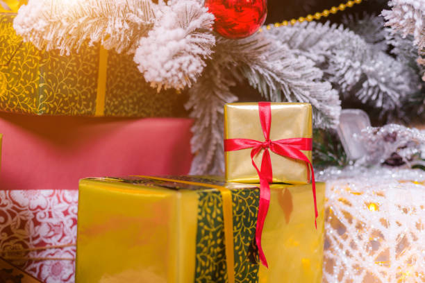 istock Gift under the tree . New year and Christmas. Holiday card. Choosing a gift. 1299101355
