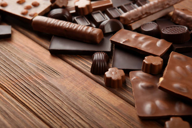 istock Chocolate products of different types on a colored background close-up with a place for text 1299101375