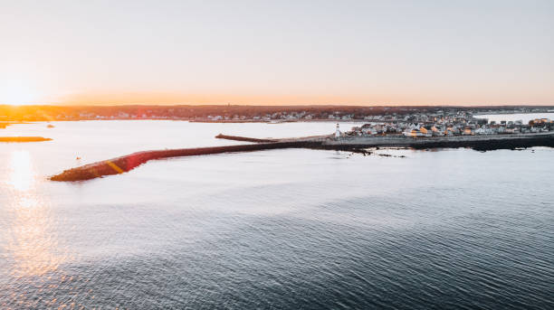 istock East Coast Ocean Beach lighthouse at Sunset 1299101464