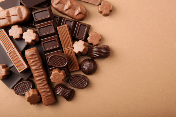 istock Chocolate products of different types on a colored background close-up with a place for text 1299101826
