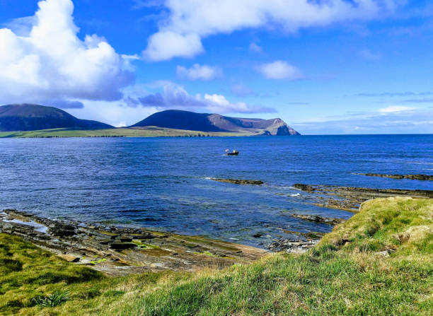 Hills of north Hoy from Ness Point Stromness Orkney Scotland the hills of North Hoy across the Hoy channel from near Stromness  (The Ness) in the Orkney Islands to the north of Scotland orkney islands stock pictures, royalty-free photos & images