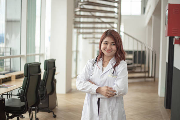istock Asian Chinese doctor smiling and looking at camera 1299102178