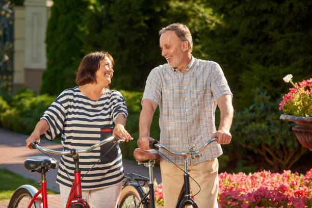 istock Happy loving couple with bikes. 1299103271