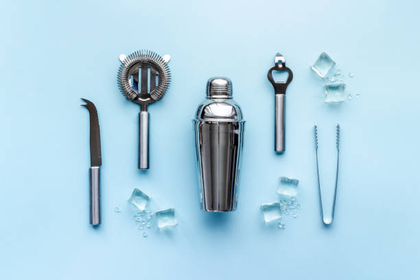 istock Set of cocktail drink tools and ingredients with shaker and ice. Flat lay 1299103396