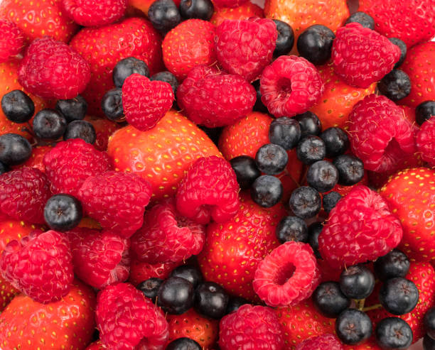 istock Strawberries, raspberries, currants on a white background with a place to copy 1299103618
