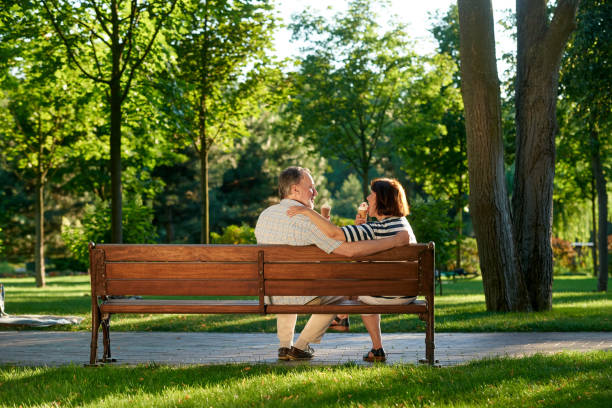 istock Happy married retired couple enjoys ice-cream. 1299105362