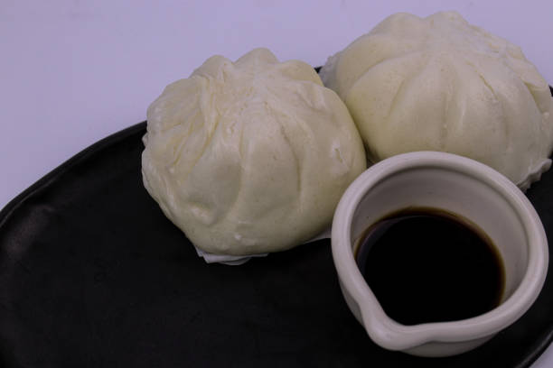 istock Chinese steamed Bun, with sour sauce 1299105727