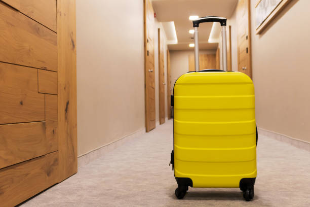 istock Yellow travel bag in a hallway. 1299106552