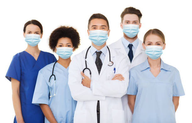 istock doctors and nurses in protective medical masks 1299107145