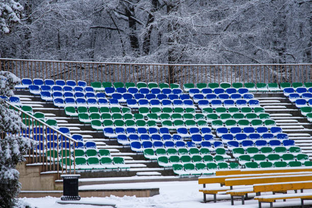 istock Snow covered outdoor concert venue with empty seats covered with snow 1299108868