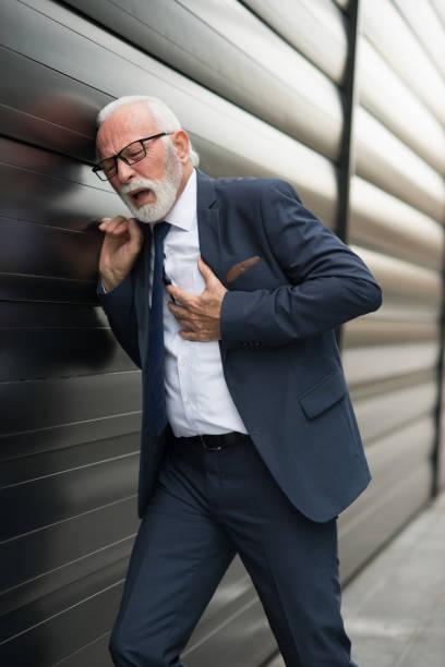 istock Senior businessman in front of office building 1299110129