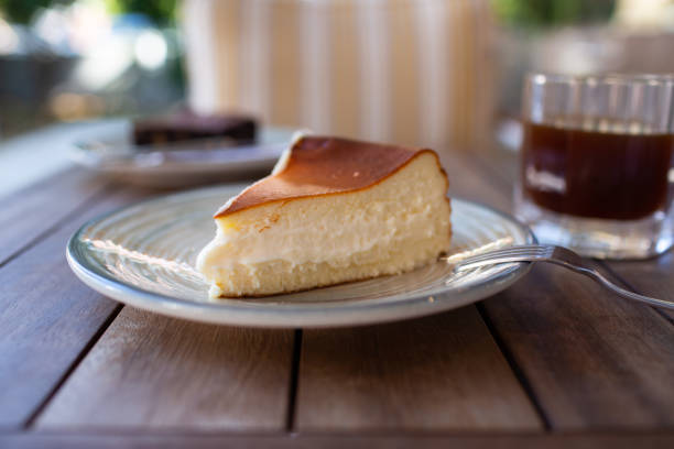 istock Cheescake San Sebastian slice on dish at cafe table 1299110230
