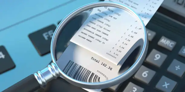 Sales receipt and magnifying glass on computer laptop background. Cash register paper printout. Groceries, supermarket shopping online payment, check the bill concept. 3d illustration