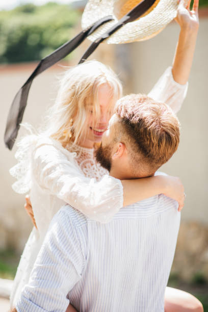 istock Very happy couple laughing outdoors in summer on a sunny day 1299113619