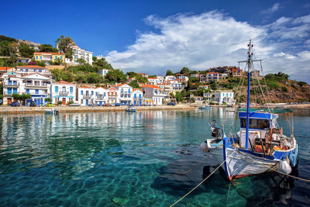 Traditional village of Evdilos, in Ikaria island, Greece, with fishing boats Traditional village of Evdilos, in Ikaria island, Greece, with fishing boats ikaria island stock pictures, royalty-free photos & images