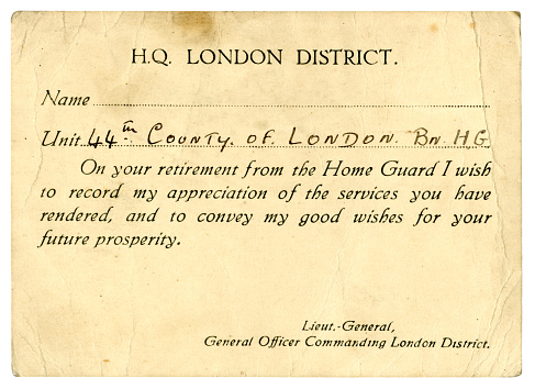 An old British World War Two Home Guard retirement card for a man who served in the 44th County of London Battalion Home Guard. The 44th comprised London Passenger Transport workers who had not been called up to serve in the regular military and who took on Home Guard duties as part of their war effort, one of their main tasks being to supply security to transport stations, power stations, depots and works, as well as occasionally for guard duty elsewhere. The Home Guard was in operation from 1940 to 1946. (Identifying details have been removed.)