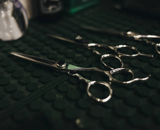 istock Vintage scissors in barbershop 1299115401