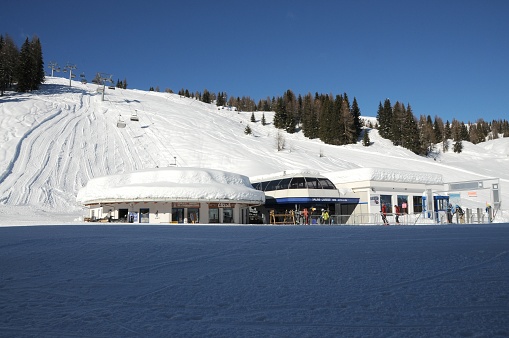 Moena, February 2014: Winter season, departure of the chairlift on the ski slopes of Passo Valles in Val di Fiemme. South Tirol in Italy.