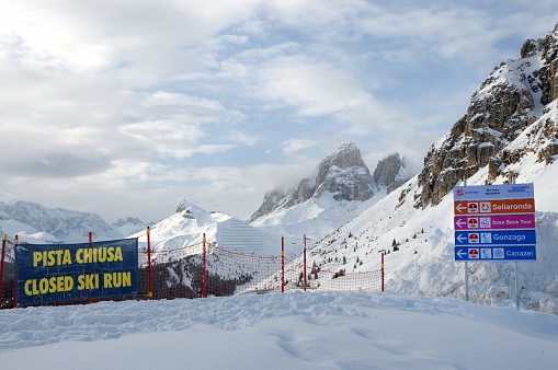 Sass Pordoi, February 2014: Signs indicate Ski slope closed for the famous Sella Ronda ski tour in the Dolomites around Canazei. South Tirol in Italy.