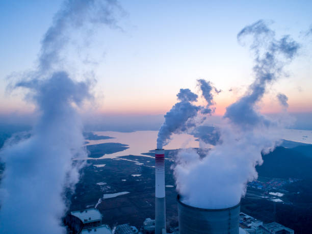 detail of a modern power plant fueled with coal and biomass - environmental damage power station factory smoke stack imagens e fotografias de stock