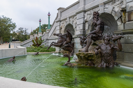 The Neptune Fountain is a bronze fountain installed in 1898 in front of the Jefferson Building of the Library of Congress. The sculptor was ROLAND HINTON PERRY.