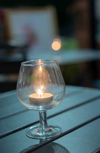 istock Candle Burning in a Glass Holder 1299120471