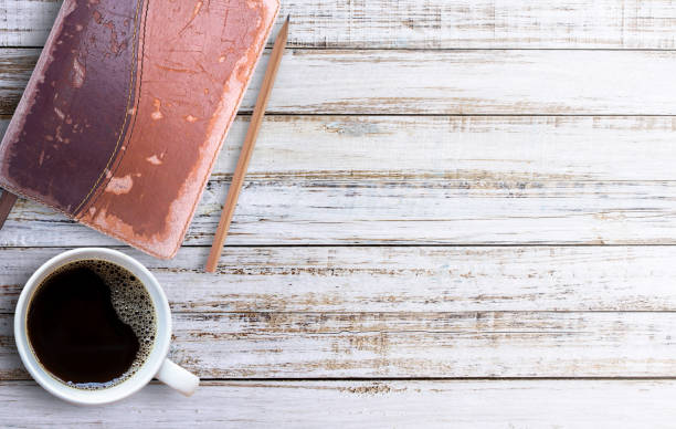 istock Office desk table with cup of coffee, 1299120618