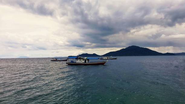 istock fishing boat and sea 1299122055