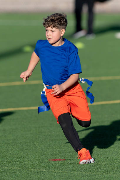istock Young Athletic Boy Playing Flag Football 1299123565