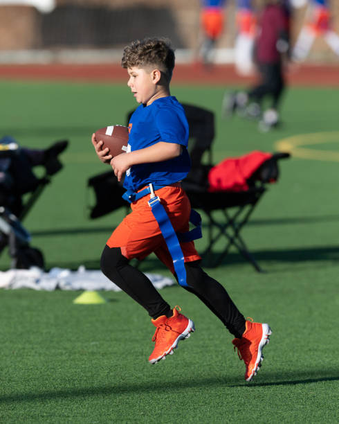 Young Athletic Boy Playing Flag Football