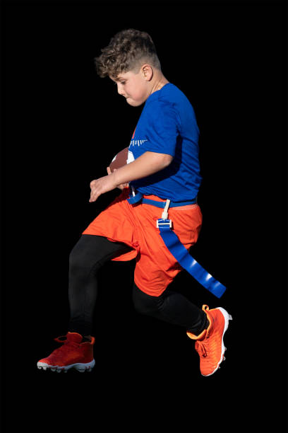 istock Young Athletic Boy Playing Flag Football 1299123608