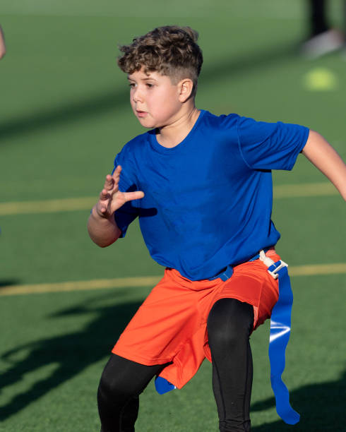 Young Athletic Boy Playing Flag Football