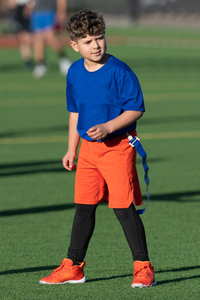 istock Young Athletic Boy Playing Flag Football 1299123635