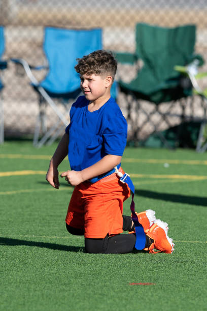 Young Athletic Boy Playing Flag Football