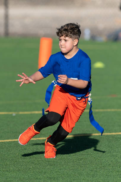 istock Young Athletic Boy Playing Flag Football 1299123660