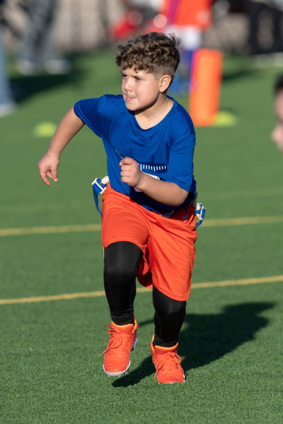 istock Young Athletic Boy Playing Flag Football 1299123673