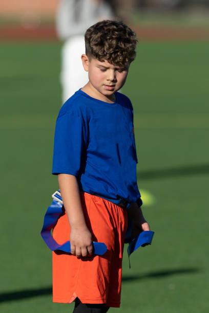 istock Young Athletic Boy Playing Flag Football 1299123685