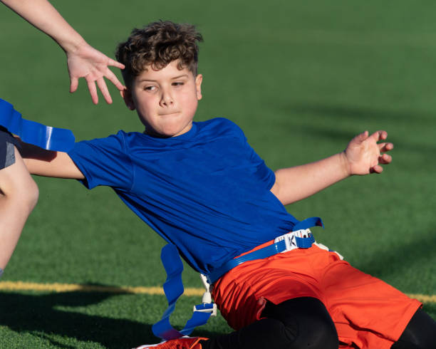 istock Young Athletic Boy Playing Flag Football 1299123687