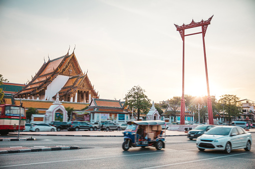 Bangkok traffic in front of Wat Suthat Temple