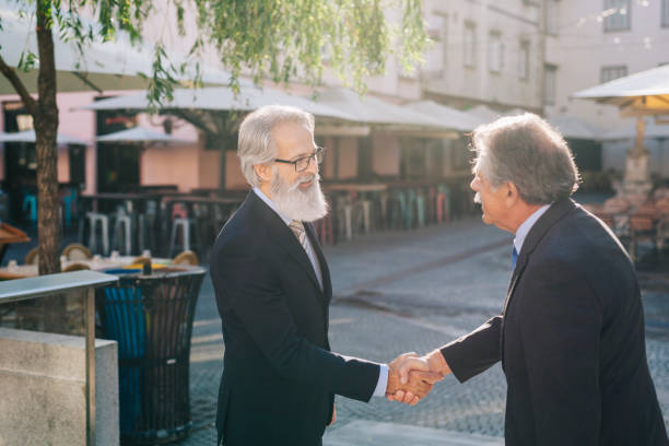 istock Happy businessman greeting each other 1299125182