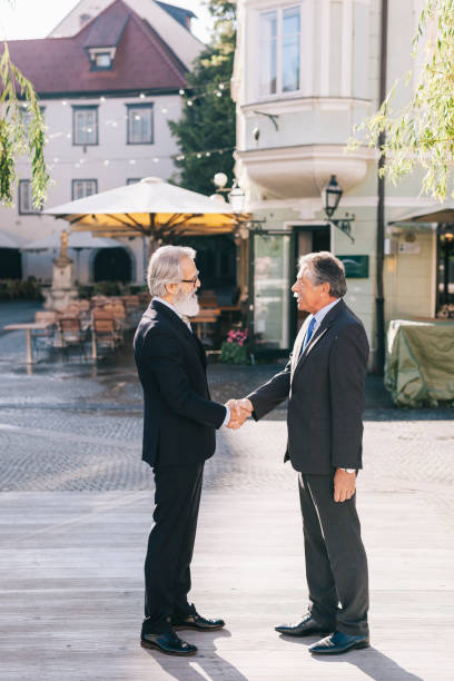 istock Happy businessman greeting each other 1299125214