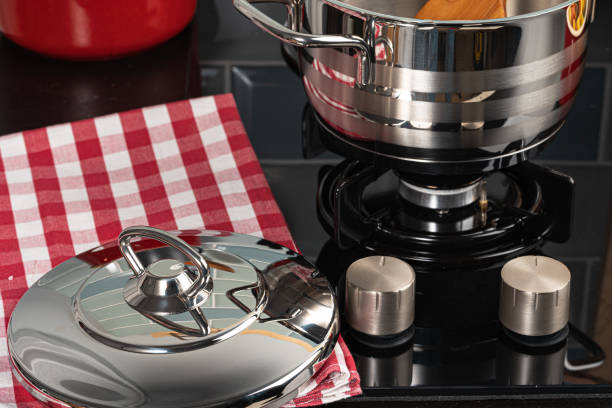 istock Metal pot on a gas stove burner close up 1299127068