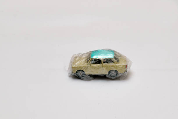 istock Miniature car wrapped in protective film with bubble 1299128432