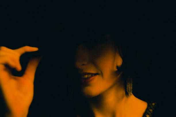 istock The beautiful young woman with the elegant hat 1299129576