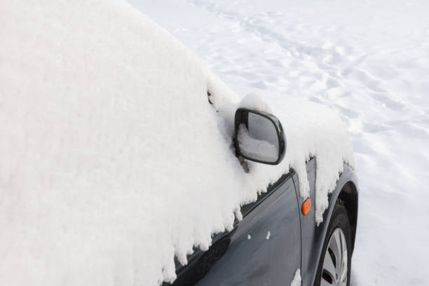 istock The mirror of the car is covered with snow. 1299129683