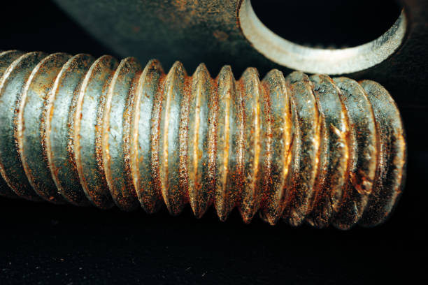 istock Iron screw bolts on black background close up 1299130547