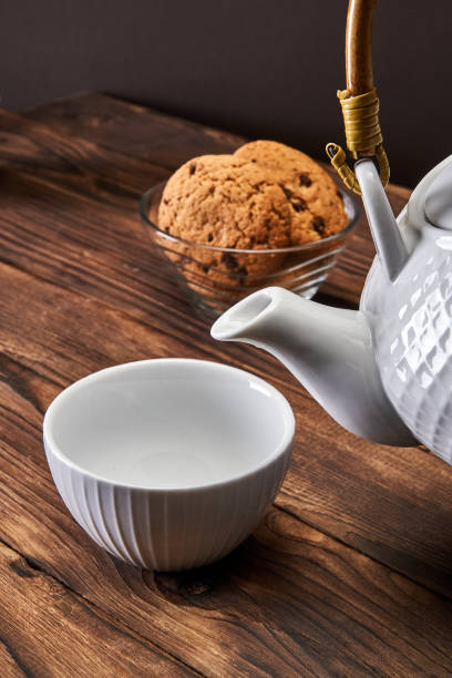istock White kettle and white cup next to cookies 1299131065