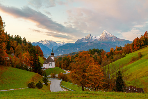 Beautiful Maria Gern church against the backdrop of the famous Watzmann Mountains in beautiful autumn colors near the charming town of Berchtesgaden in Bavaria, Germany