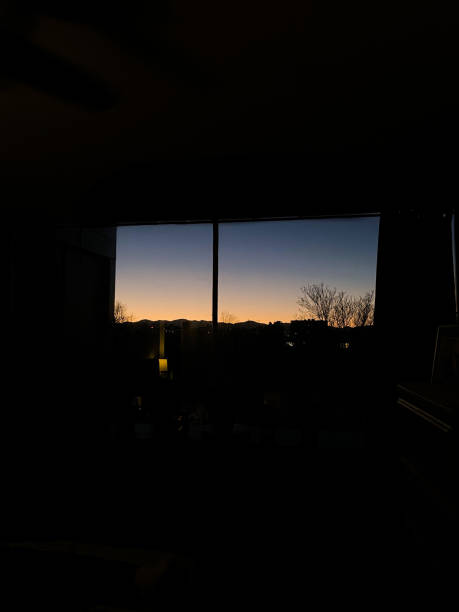 istock Sunset of the mountains from condo in Denver 1299133726