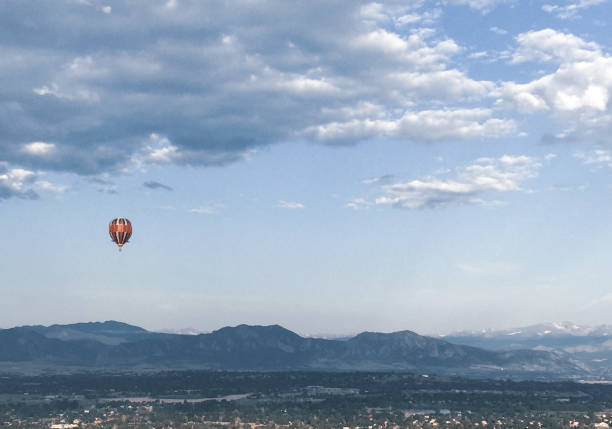 istock Hot air balloon in Rocky Mountains 1299133732